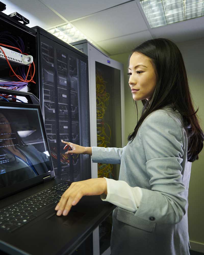 Woman working on computer server
